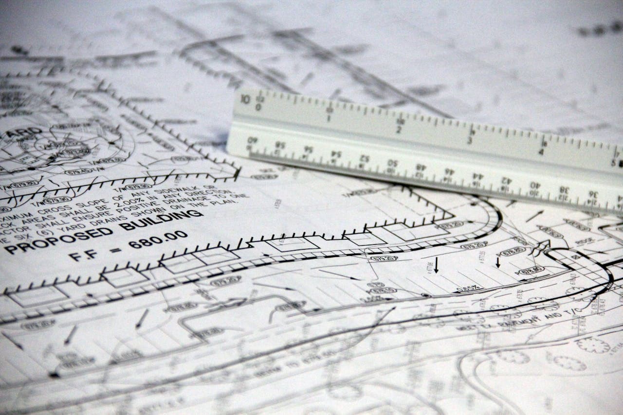 White ruler on printed paper